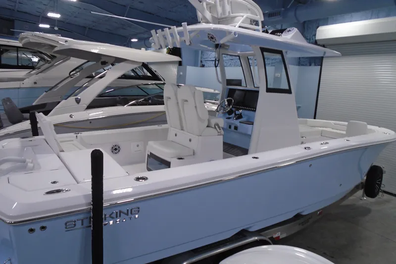 Slide: The Image of 2027 Striking Boats 27XB in showroom, featuring sleek design and modern amenities. - 16