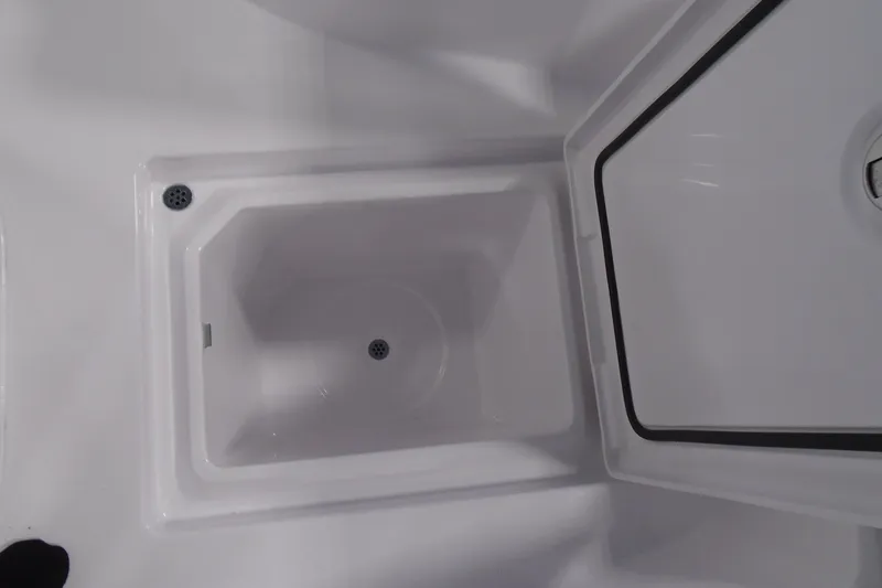 Slide: The Image of Interior compartment of 2027 Striking Boats 27XB, featuring a sleek, white design. - 24