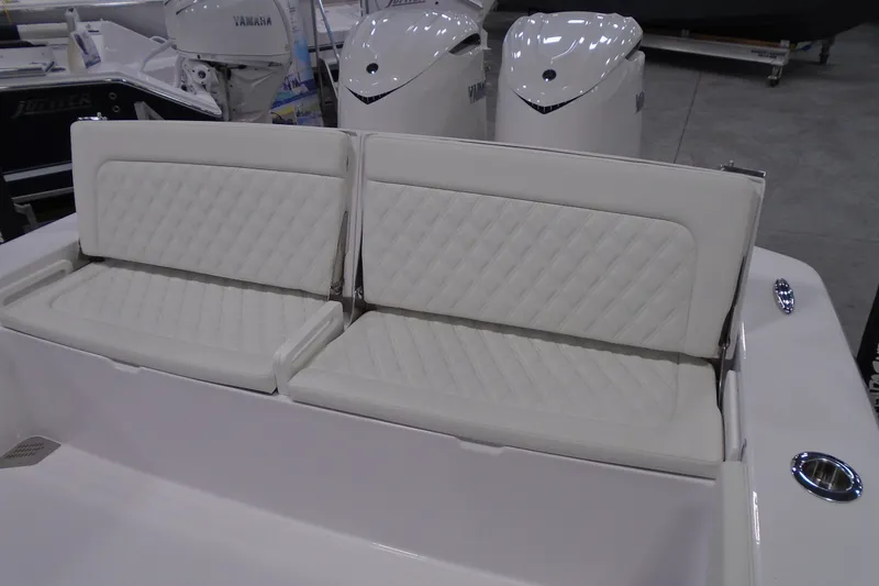 Slide: The Image of Luxury seating on 2027 Striking Boats 27XB, featuring diamond-stitched upholstery and Yamaha engines. - 14