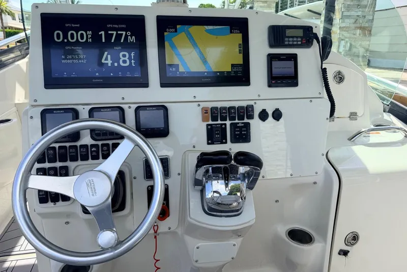 Slide: The Image of 2005 Hydra-Sports Vector 3300 VX boat dashboard with navigation and control systems. - 5