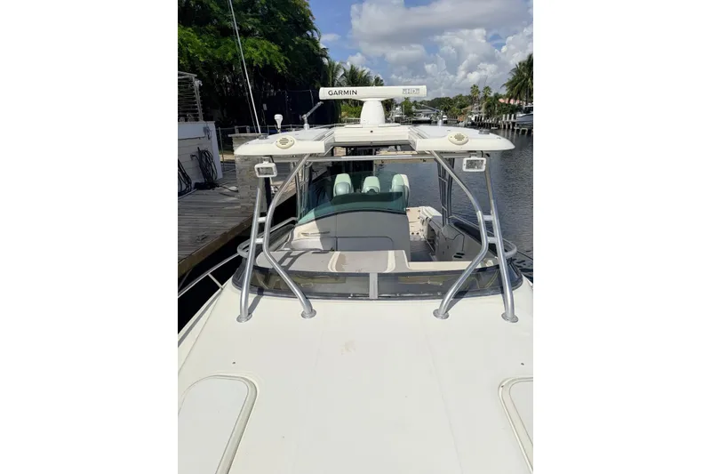 Slide: The Image of 2005 Hydra-Sports Vector 3300 VX boat docked, featuring Garmin radar equipment. - 20