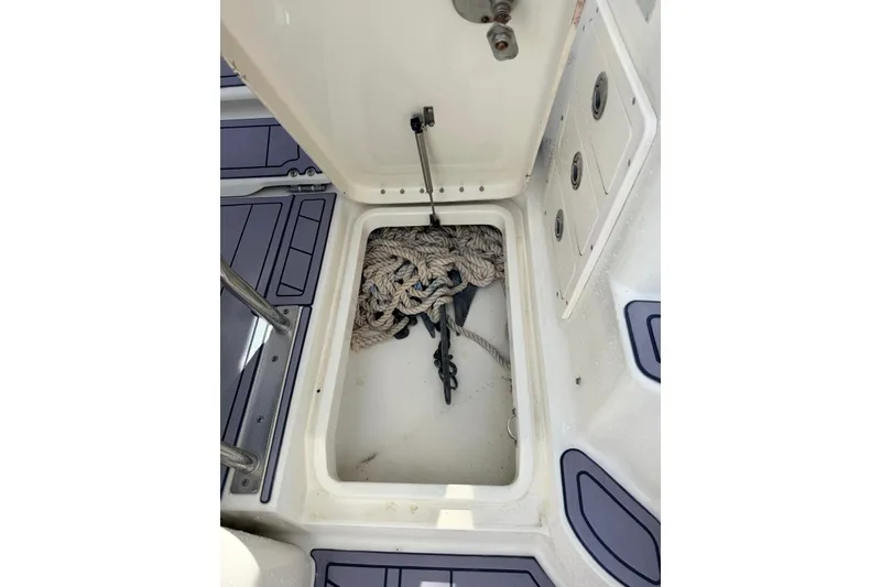 Slide: The Image of 2005 Hydra-Sports Vector 3300 VX anchor storage with rope and anchor inside compartment. - 13