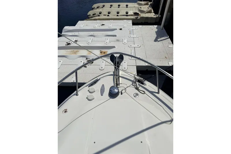 Slide: The Image of 2005 Hydra-Sports Vector 3300 VX boat docked at a marina, viewed from the bow. - 19