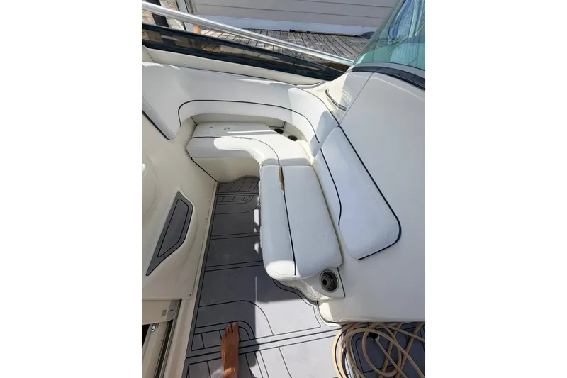 Slide: The Image of 2005 Hydra-Sports Vector 3300 VX boat interior with white seating and deck details. - 17