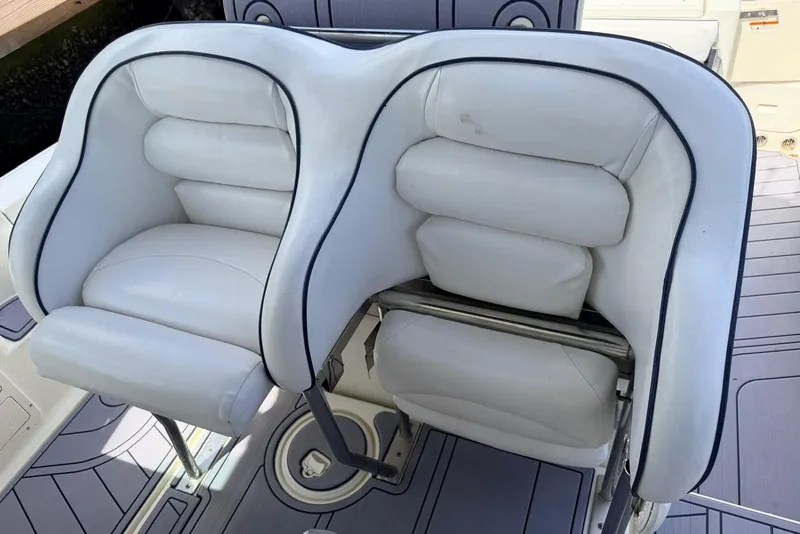 Slide: The Image of 2005 Hydra-Sports Vector 3300 VX boat seats, featuring white cushioned design and sleek finish. - 11