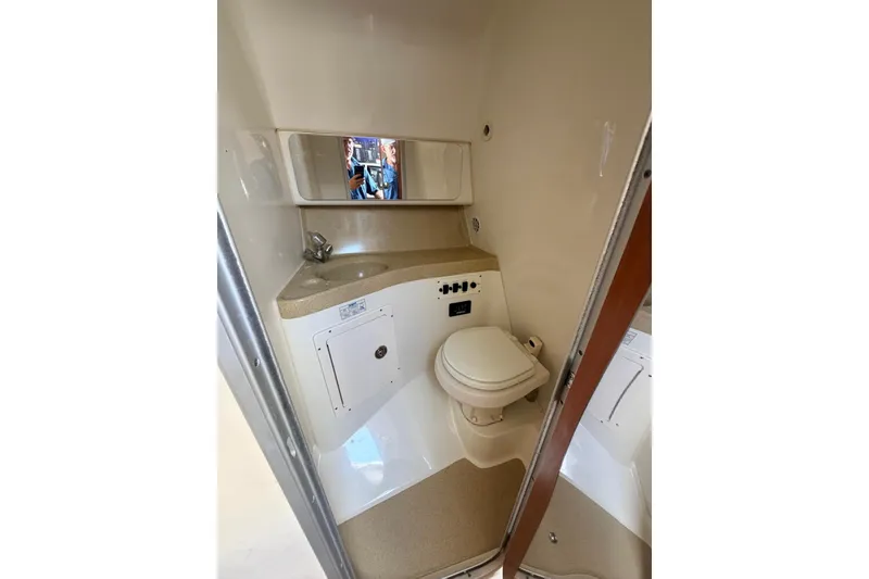 Slide: The Image of 2005 Hydra-Sports Vector 3300 VX boat bathroom with sink and toilet. - 27