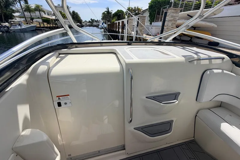 Slide: The Image of 2005 Hydra-Sports Vector 3300 VX boat interior, featuring sleek seating and storage compartments. - 18