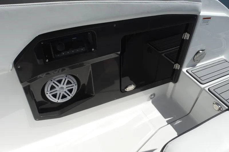 Slide: The Image of 2024 Monterey 255SS Super Sport boat interior with speaker and storage compartment. - 17