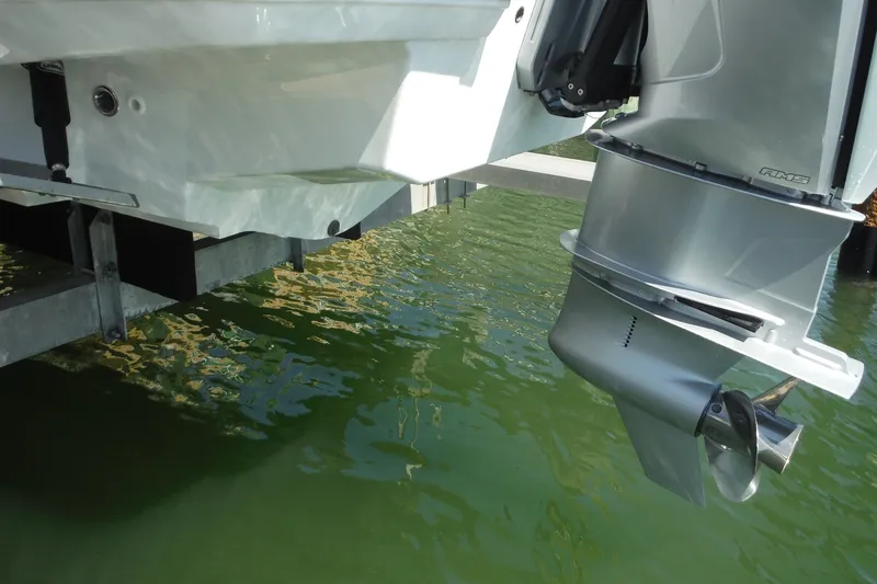 Slide: The Image of 2024 Monterey 255SS Super Sport boat engine and propeller above green water. - 44