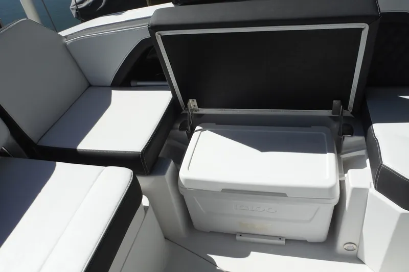 Slide: The Image of 2024 Monterey 255SS Super Sport boat interior with seating and storage compartment. - 20