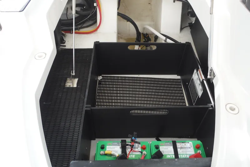 Slide: The Image of 2024 Monterey 255SS Super Sport boat battery compartment with Interstate batteries. - 26