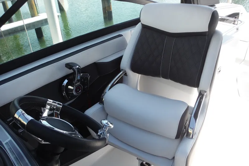 Slide: The Image of Luxurious cockpit of 2024 Monterey 255SS Super Sport boat with sleek steering wheel. - 24