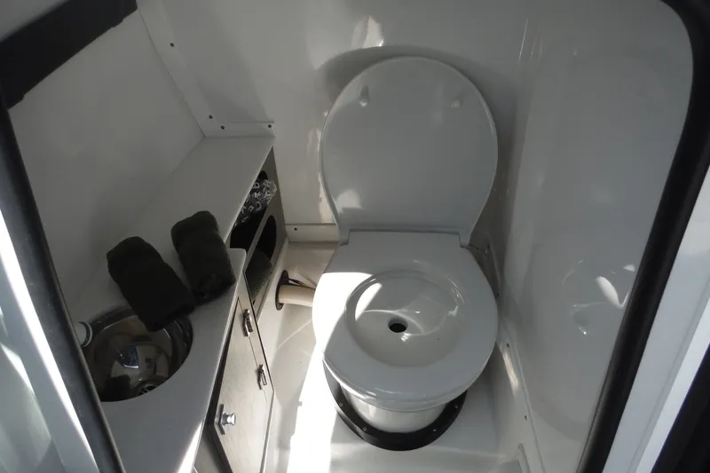 Slide: The Image of 2024 Monterey 255SS Super Sport boat bathroom with toilet and sink. - 30