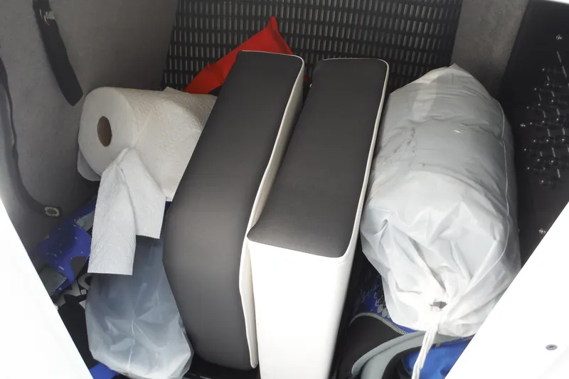 Slide: The Image of Storage compartment in 2024 Monterey 255SS Super Sport boat with cushions and supplies. - 21