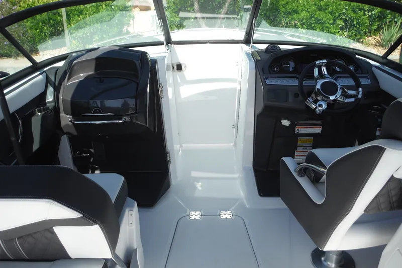 Slide: The Image of 2024 Monterey 255SS Super Sport boat interior with sleek dashboard and modern steering wheel. - 22