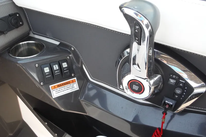 Slide: The Image of Control panel of 2024 Monterey 255SS Super Sport boat with throttle and warning label. - 14