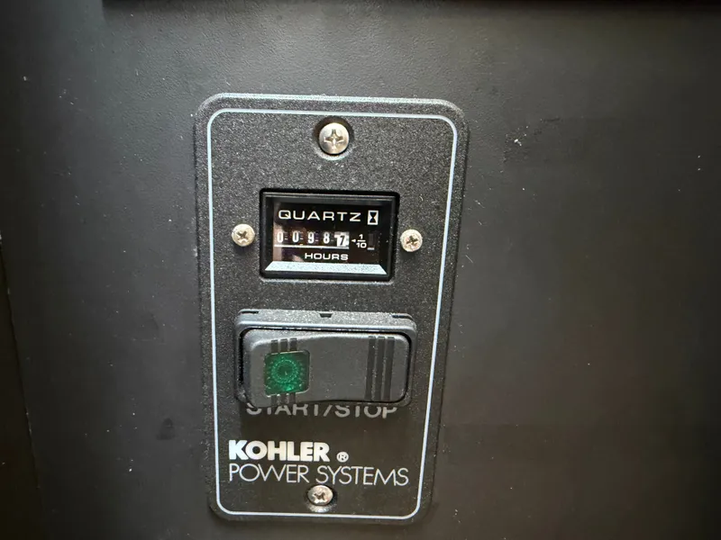 Slide: The Image of A Kohler Power Systems hour meter displays 987.1 hours. - 40