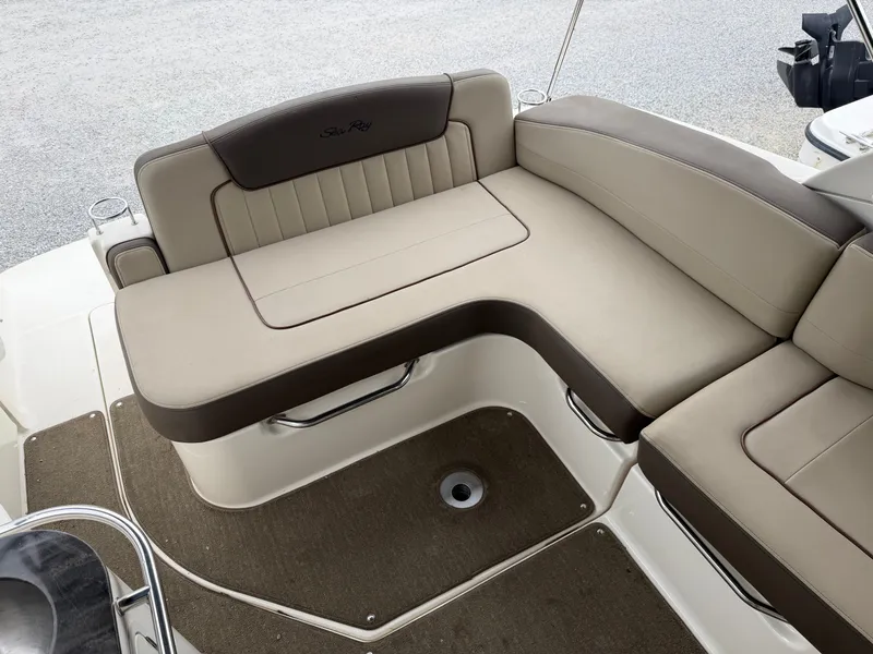 Slide: The Image of The 2014 Sea Ray Sundancer 280 features an elegant, beige upholstered seating area at the stern. - 17