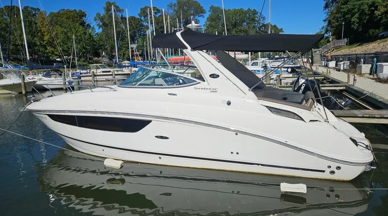 The Image of A 2014 Sea Ray Sundancer 280 is docked in the water. - 0