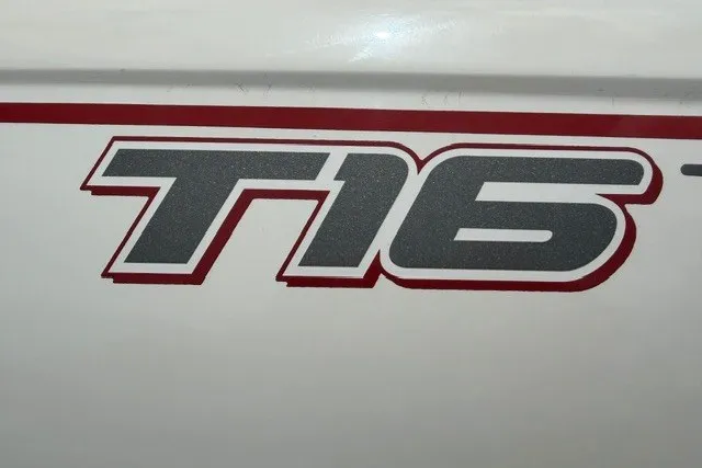 Slide: The Image of 2021 Tahoe T16 logo on white surface with red accents. - 4
