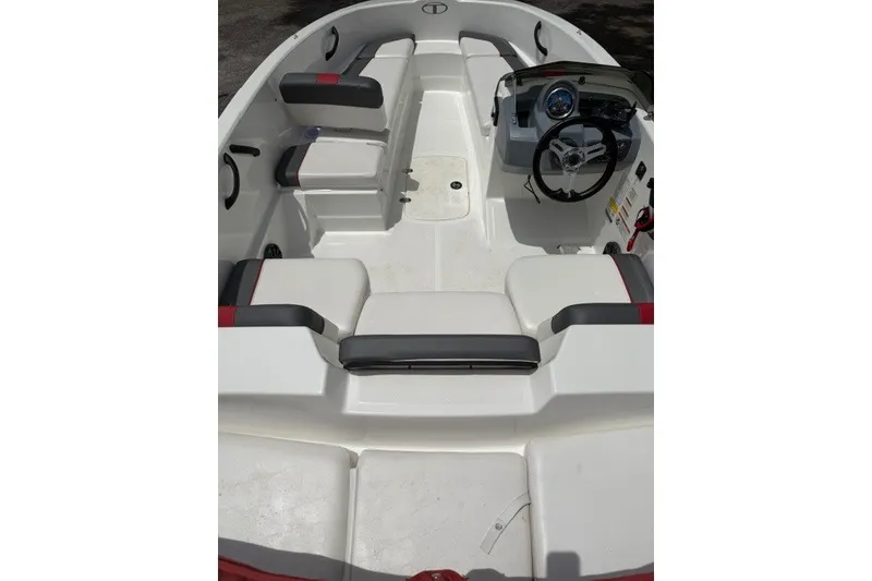 Slide: The Image of 2021 Tahoe T16 boat interior with seating and steering console. - 13