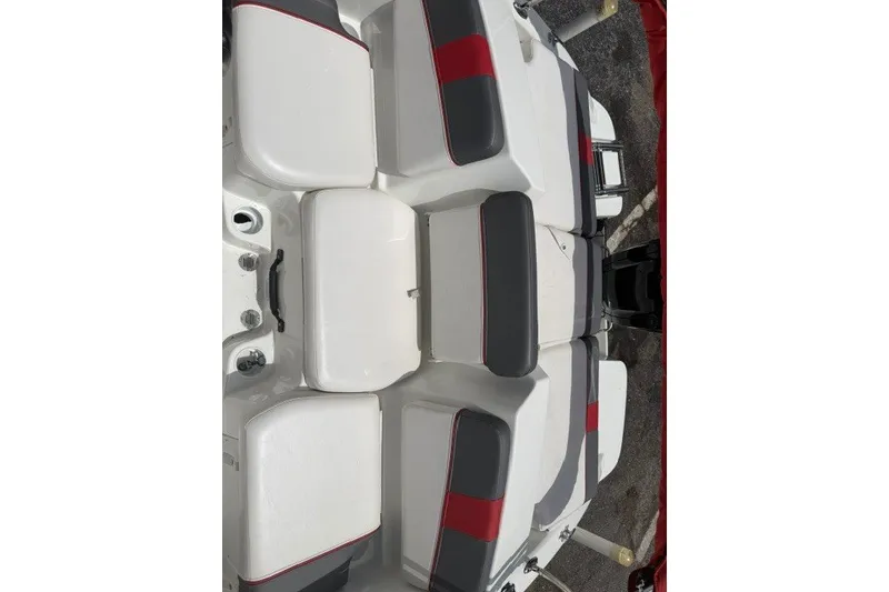 Slide: The Image of 2021 Tahoe T16 boat interior with white and gray seating, featuring red accents. - 12