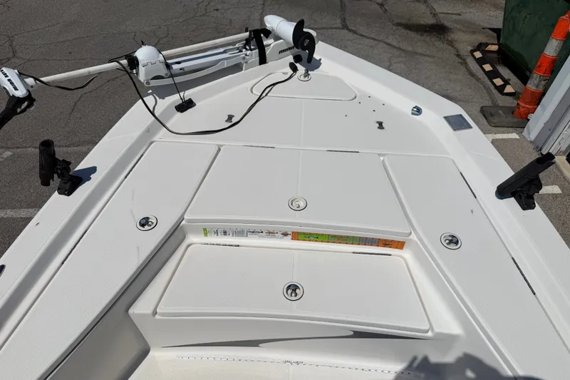 Slide: The Image of 2016 Blue Wave 2200 STL boat deck with mounted equipment and storage compartments. - 15