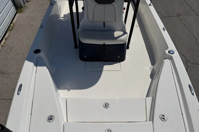 Slide: The Image of 2016 Blue Wave 2200 STL boat interior with seating and storage compartments. - 17