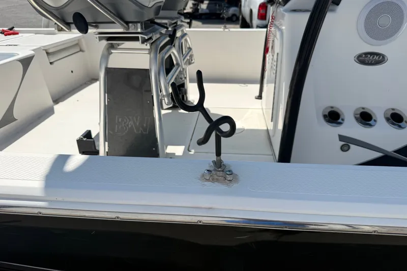Slide: The Image of 2016 Blue Wave 2200 STL boat interior with rod holder and seating area. - 37