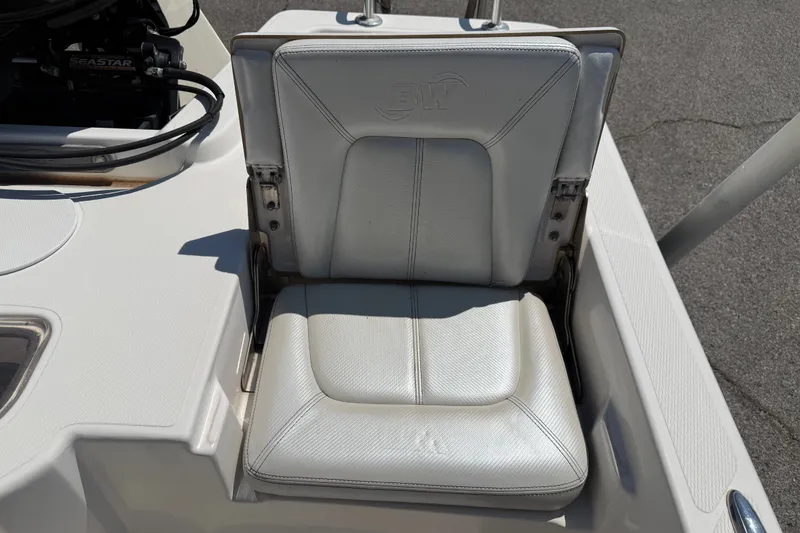 Slide: The Image of White seat on 2016 Blue Wave 2200 STL boat, featuring BW logo. - 30