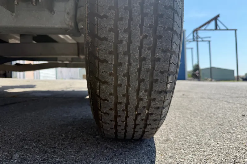 Slide: The Image of Close-up of a 2016 Blue Wave 2200 STL trailer tire on asphalt. - 38
