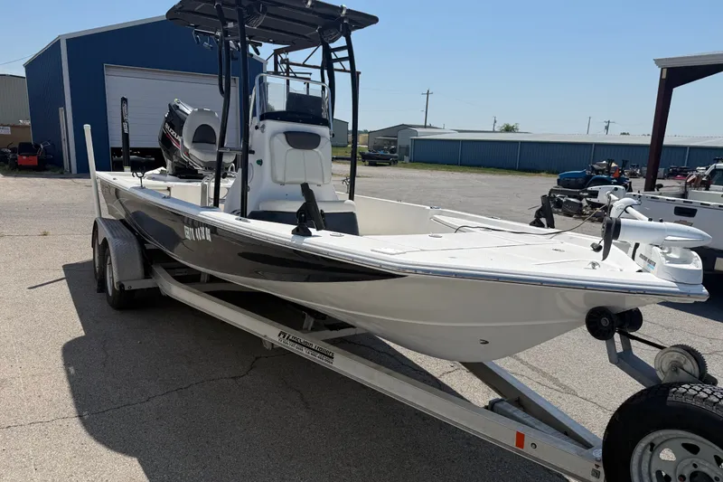 Slide: The Image of 2016 Blue Wave 2200 STL boat on trailer in outdoor storage area. - 6