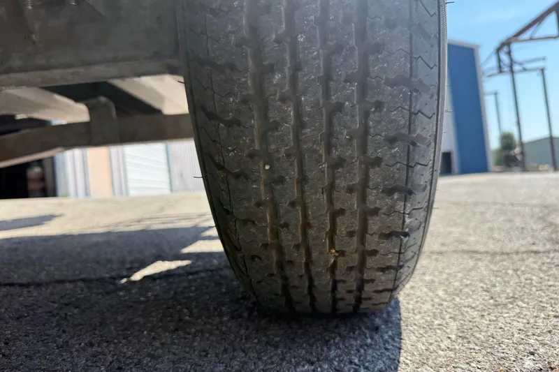 Slide: The Image of Close-up of a 2016 Blue Wave 2200 STL trailer tire on pavement. - 39