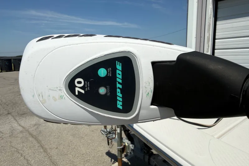 Slide: The Image of Close-up of a Riptide motor on a 2016 Blue Wave 2200 STL boat. - 16