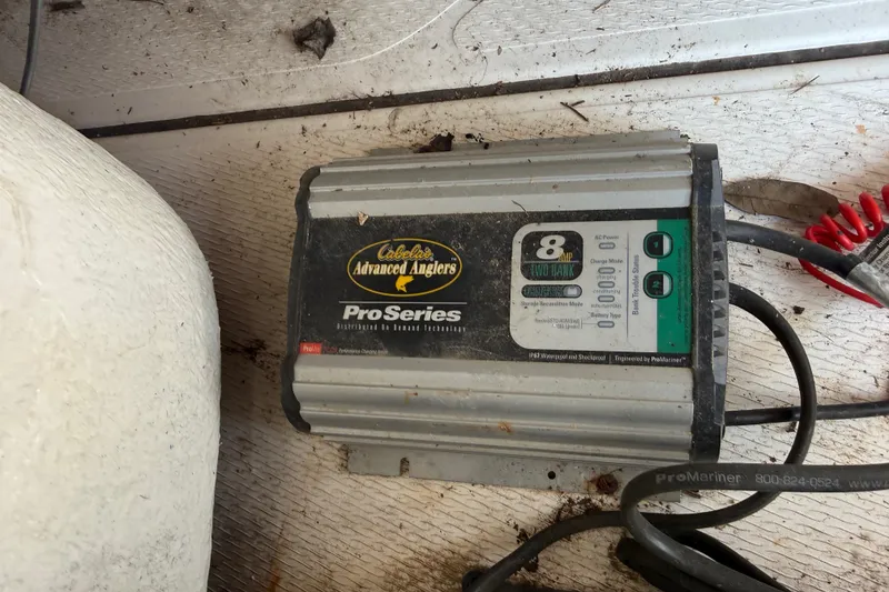 Slide: The Image of Cabela's Advanced Anglers ProSeries battery charger on 2016 Blue Wave 2200 STL boat floor. - 32