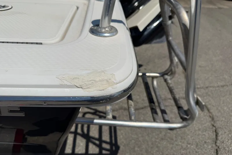 Slide: The Image of 2016 Blue Wave 2200 STL boat with minor damage on the rear platform edge. - 33