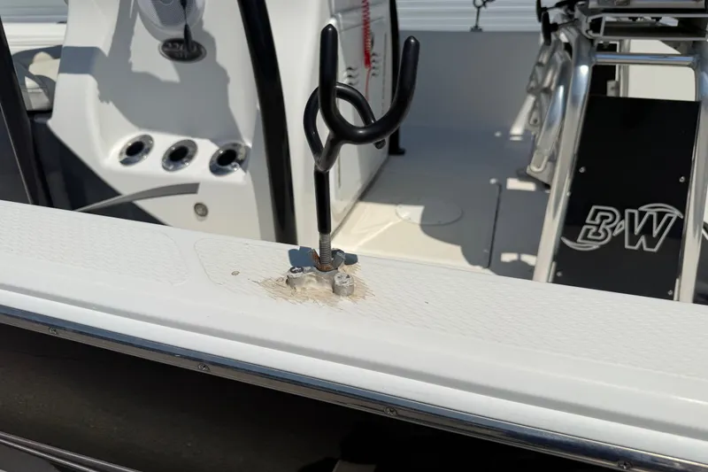 Slide: The Image of 2016 Blue Wave 2200 STL boat interior with rod holder and console details. - 34