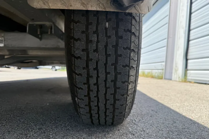 Slide: The Image of Close-up of a 2016 Blue Wave 2200 STL trailer tire on pavement. - 40