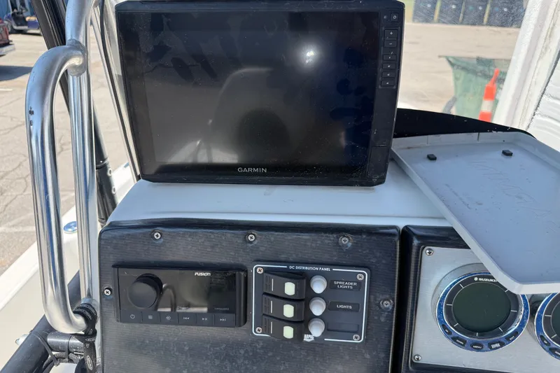 Slide: The Image of Control panel of a 2016 Blue Wave 2200 STL boat with Garmin display. - 25