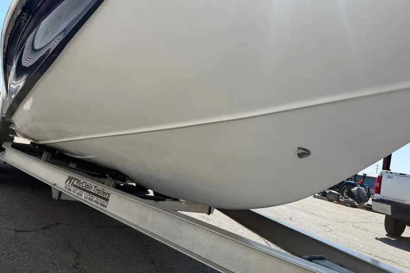 Slide: The Image of 2016 Blue Wave 2200 STL boat on McClain trailer, side view. - 13