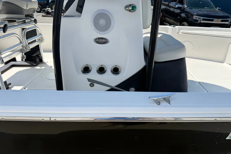 Slide: The Image of 2016 Blue Wave 2200 STL boat interior with seating and control panel. - 36
