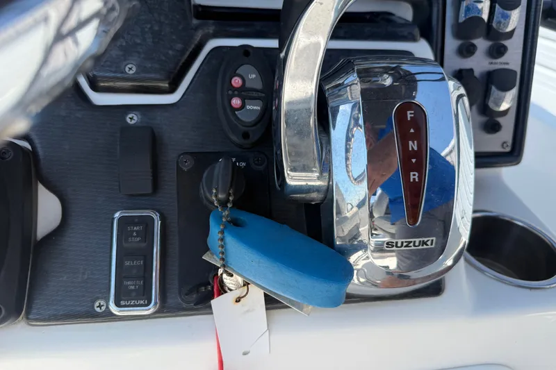 Slide: The Image of Control panel of a 2016 Blue Wave 2200 STL boat with Suzuki throttle. - 24