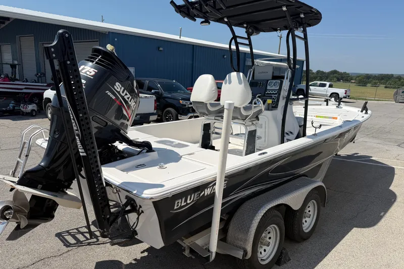 Slide: The Image of 2016 Blue Wave 2200 STL boat with Suzuki 115 engine on trailer. - 5