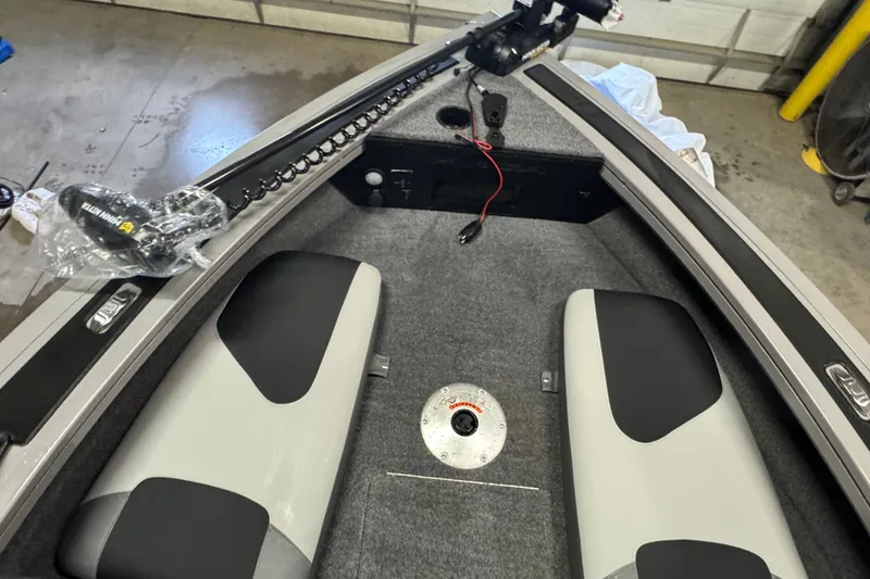 Slide: The Image of Interior of 2027 Tracker Targa V-18 Combo boat with seating and equipment. - 13