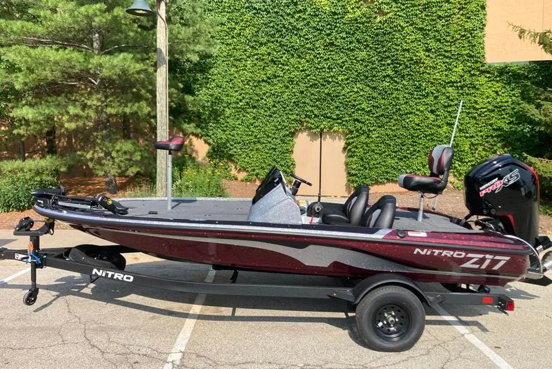 The Image of 2027 Nitro Z17 boat with sleek design, parked outdoors, surrounded by greenery. - 0