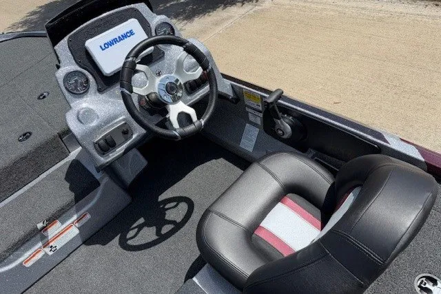 Slide: The Image of Steering console of 2027 Nitro Z17 boat with Lowrance display and cushioned seat. - 33