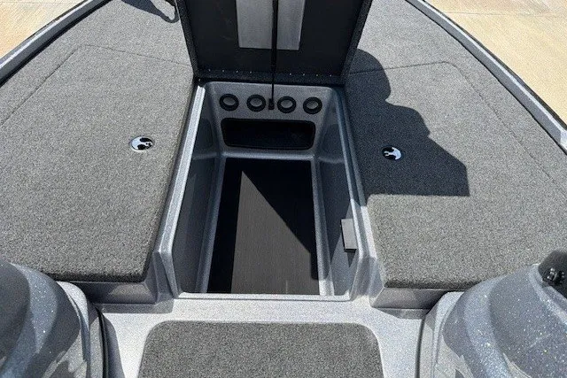 Slide: The Image of Nitro Z17 2027 boat interior with open storage compartment and carpeted deck. - 28