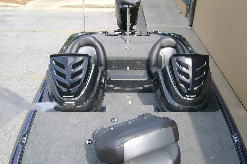 Slide: The Image of 2027 Nitro Z17 boat interior with sleek black seats and modern design. - 8