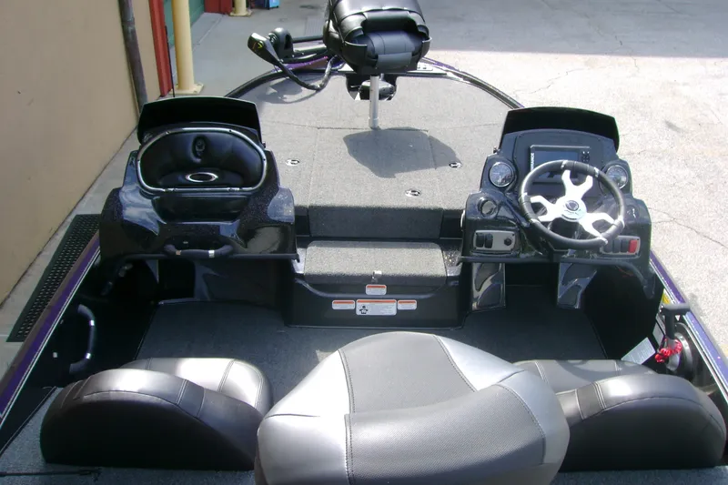 Slide: The Image of Interior of a 2027 Nitro Z17 boat featuring steering console and seating. - 9