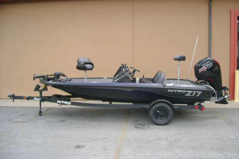 Slide: The Image of 2027 Nitro Z17 fishing boat with trailer, parked outdoors. - 1
